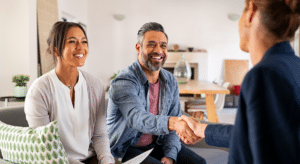 Friendly couple shaking hands with fundraiser